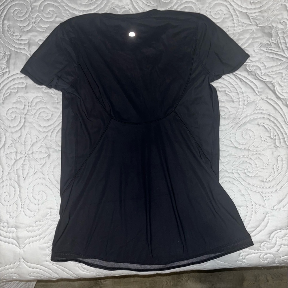 Lululemon Athletica black shirt with see through detail in the bottom